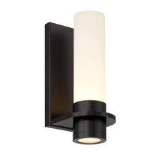 a black wall light with a white cylinder on it