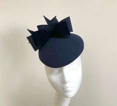 A very elegant navy blue wool felt pillbox style hatinator with double bow detailing.  Made in a gorgeous shade of midnight blue. This percher features matching felt double bows and tails and a statement midnight blue velvet bow that sits to the front.  Measuring 20cm front to back and 17cm side to side, this percher is fitted with a fine elastic in a colour to blend in with your own hair colour, that sits to the back of the head and underneath the hairline.  This would be the perfect choice for Elegant Navy Hat For Evening, Elegant Felt Cloche Hat, Elegant Felt Mini Hat With Short Brim, Elegant Fitted Felt Mini Hats, Elegant Felt Hat For Party, Elegant Party Felt Hat, Wedding Felt, Navy Blue Velvet, Unique Hats