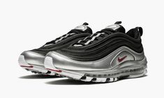 This Nike Air Max 97 offers a modified take on the Nike runner's original "Silver Bullet" Colorway with updated color blocking.  The upper sports black mesh with tonal overlays, while shiny metallic silver makes a statement towards the mudguard and sole.  Red branding hits the side panel, tongue, and heel tab.  As it’s done for over two decades, the Nike Air Max 97 hosts a foam sole with full-length Max Air cushioning. Red Branding, Nike Runners, Silver Bullet, Stadium Goods, Nike Air Max 97, Black Mesh, Air Max Sneakers, Panel Siding, Air Max