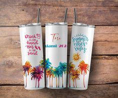 three personalized tumbles with colorful palm trees on them