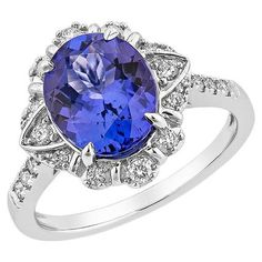 This collection features a selection of the most tantalizing Tanzanite. Uniquely designed with rounds diamonds. The rich purple-blue hues of this gemstone with diamonds set in white gold to present a rich and regal look. Tanzanite Fancy Ring in 18Karat White Gold with Diamond. Tanzanite: 2.70 carat, 10X8mm size, cushion shape. Diamond: 0.01 carat, 1.20mm size, round shape, G color, VS clarity. Diamond: 0.03 carat, 1.20mm size, round shape, G color, VS clarity. Diamond: 0.04carat, 1.40mm size, round shape, G color, VS clarity. Diamond: 0.072 carat, 1.50mm size, round shape, G color, VS clarity. Diamond: 0.075 carat, 1.70mm size, round shape, G color, VS clarity. Gold: 4.25g, 18Karat White Gold. TZ384