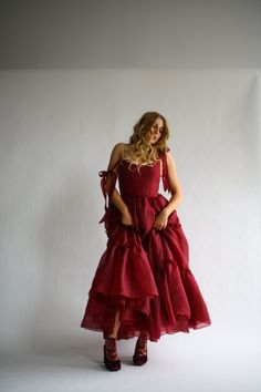 Our signature Siena silhouette: now in a full length gown version. The Siena gown features floor length three tier dress in the perfect shade of dark cherry red for the ultimate romantic look. The bust features V shaped corset boning that gives a flattering look. Red Fitted Organza Gown, Red Ruffled Gown For Banquet, Red Dress Engagement, Snowball Dresses, Solstice Wedding, Dark Cherry Red, Guest Ideas, Best Gowns, Prom Inspo