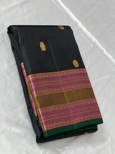 Bridal Collection Black Color Pure Kanchipuram Silk Saree | Indian Traditional Ethnic Saree | Wedding or Party Wear Saree | Handwoven Gift Saree for Her Product Details : Saree Type : Pure Kanchipuram Silk Saree Golden Zari, Silk Mark Certified Blouse Piece : Yes (Un-Stitched) Saree Length : 5.5 Meters Blouse Piece Length : 80 cm Saree Weight : 0.9 kg Saree Fabric : Pure Kanchipuram Silk  Color : As shown in the picture Work : weaving Pattern : designer Occasion: Party Wear, Formal Wear, Festiva Saree Golden, Ethnic Saree, Stitched Saree, Party Wear Saree, Ethnic Sarees, Kanchipuram Silk Saree, Wear Saree, Indian Traditional, Weaving Patterns