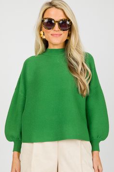 This ribbed sweater features statement balloon sleeves, a mock neckline, and a boxy shape. The length pairs perfectly with high waisted bottoms! Chic Ribbed Cropped Sweater For Fall, Ribbed Cropped Sweater For Fall Workwear, Fall Ribbed Cropped Sweater For Work, Oversized Cropped Sweater With Ribbed Neckline For Spring, Chic Textured Knit Turtleneck Cropped Sweater, Chic Balloon Sleeve Sweater For Spring, Chic Knit Tops With Balloon Sleeves, Chic Knit Balloon Sleeve Tops, Oversized Sweater With Balloon Sleeves And Ribbed Cuffs