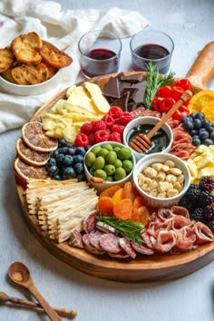 a wooden platter filled with different types of food