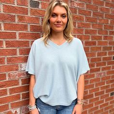 Introducing our chic and contemporary women's fashion top, where style meets comfort effortlessly. The cocoon sleeves add a modern twist, offering a relaxed yet flattering silhouette that drapes beautifully. Whether you're heading to a brunch date or a casual evening out, this versatile piece effortlessly transitions from day to night. Pair it with your favorite jeans for a laid-back vibe, or dress it up for a polished look. Fall Faves, Southern Women, Brunch Date, Casual Evening, Fashion Top, Oversized Tee, Short Rompers, Dress Romper, Polished Look