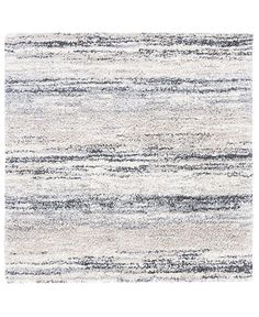 an area rug with grey and white stripes