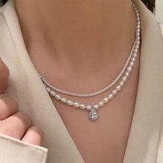 Material: genuine freshwater pearl,S925 sterling silver with Rhodium plated connector, alloy with gold plated pendantLuster: highPearl size:4-5Blemish: few blemishLength: 42cm (16.5 inches)The silver necklace in the picture:https://www.etsy.com/listing/1038541031/solid-sterling-silver-necklace-925?ref=shop_home_active_1&pro=1&frs=1DISCOUNTS ON LARGE ORDERSGet 10% off for order $50-$99Get 15% off for order $99-$199Get 20% off for order $200-$399Get 25%off for order $400 and more Pearl Necklace Elegant, Silver Pearl Choker With Clavicle Chain, Silver Pearl Choker Necklace With Clavicle Chain, Silver Pearl Clavicle Choker Necklace, Elegant White Charm Necklace Choker, Elegant White Charm Choker Necklace, Silver Pearl Charm Necklace With Pearl Chain, Silver Pearl Drop Choker Necklace, Elegant Pearl Pendant Charm Choker