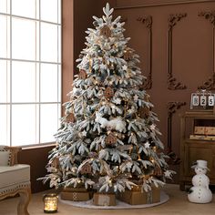 a decorated christmas tree in a living room