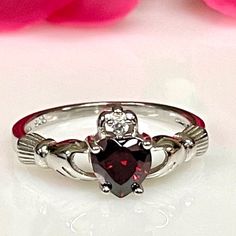 925 Sterling Silver Claddagh Irish Garnet Cz Ring * Metal :925 Sterling Silver * Stone :Grade Aaa Cubic Zirconia *Shape Heart 6mm *Design :Claddagh Irish Promise Rung * Color :White Gold Rhodium For Anti Tarnish. Irish Wedding Rings, Claddagh Ring Wedding, Gothic Engagement Ring, Dream Wedding Ring, Irish Ring Claddagh, Celtic Engagement Rings, Irish Rings, Garnet Heart, Irish Claddagh