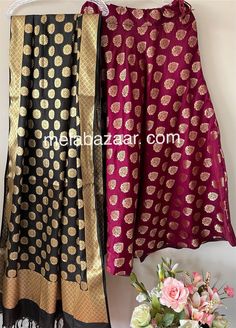 Soft and flowy Banarsi satin silk lehenga/skirt with a big flare and a coordinating Banarsi dupatta. Skirt length: 40 inches. Skirt waist: fits up to 38 inches. Dupatta: 96 by 34 inches. Color: Black and Wine Floor-length Banarasi Silk Sharara For Festive Occasions, Traditional Satin Saree Set, Party Set With Long Skirt And Dupatta, Designer Zari Work Dupatta For Long Skirt, Designer Long Skirt Dupatta With Zari Work, Anarkali Style Art Silk Lehenga, Traditional Satin Sets With Unstitched Blouse, Festive Party Sets With Flared Skirt, Satin Sharara With Zari Work In Traditional Drape