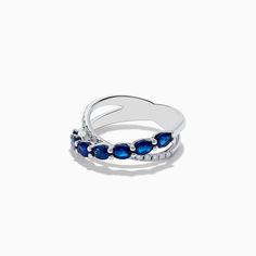 a white gold ring with blue sapphire stones