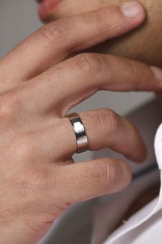 a man wearing a wedding band and ring