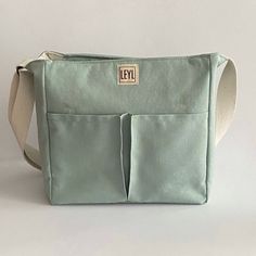 "Handmade cotton canvas tote bag with zipper that I specially designed for everyday use. Check out my tote bags for the very best in unique or custom, handmade from women's bags shop. If you want to see a different style, take a look at my collection ⬇ https://etsy.me/3fgNzR9 🎁 WHAT IS IN THE PACKAGE * 1 piece Large tote bag with zipper closure Usage: Shoulder Bag and Crossbody Bag Gender: Unisex In summary; Total pockets: 9 pockets and 2 pen holders BODY *  Cotton Canvas. The fabric has stain-proof and water-repellent properties with OEKO-TEX Standard 100 certified. (It is not completely waterproof, however.) *  Zip closure and cover * BODY FRONT:  2 pockets * BODY BACK:  1 large pocket * Fixed and adjustable canvas strap INTERIOR  *  100% cotton lining *  SIDE: 2 small pocket *  INTERIO Tote Bag With Compartments, Bag With Compartments, Planner Pouch, Tote Bag With Zipper, Teacher Tote Bag, Teacher Tote, Fabric Tote Bags, Bag With Zipper, Crossbody Tote Bag