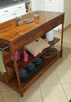 a kitchen island made out of wood with shoes on it