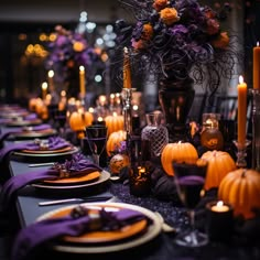 the table is set with purple and orange decorations