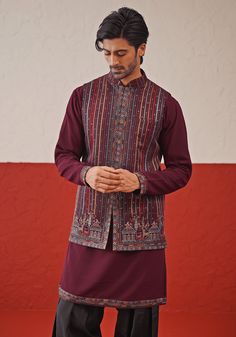 Elevate your wardrobe with Wine Jacket Kurta. Crafted from luxurious georgette, features resham and sequinned embroidery on a closed jacket. Teamed with a yoke design kurta, intricate cuffs, detailed daman, and matching embroidered dupatta and pants. Perfect for special occasions like Sangeet, Mehendi, or as a wedding guest outfit. Composition : Jacket, Kurta, Trouser & Dupatta : Viscose Georgette Care: Dry Clean Only and Vacuum Storage This product can be customized for sleeves, length and colour Delivery : 4-6 weeks as the product is hand crafted. Check Size Guide or choose MySize for free customisation (All Sizes above XL can be made at 15% additional cost) For more information and sizes please contact fabiliciousfashion@gmail.com or visit our Copenhagen studio. About the Designer : Wel Traditional Fitted Outerwear With Embroidered Sleeves, Embroidered Fitted Straight Kurta Outerwear, Designer Chikankari Embroidered Kurta For Fall, Fitted Embroidered Straight Kurta Outerwear, Intricate Embroidery Festive Sets For Fall, Festive Sets With Intricate Embroidery For Fall, Festive Fall Sets With Intricate Embroidery, Festive Nehru Jacket With Chikankari Embroidery For Fall, Embroidered Designer Wear Sets For Fall