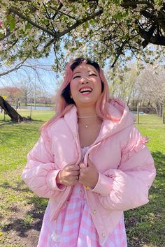 This super-cute pastel pink puffer features puffy bear ears, a gold zipper and buttons, and ruffle detailing on the sleeves. The Pink Marshmallow Bear Puffer is light enough for a cool Spring day and like the name implies - it's super fluffy like a marshmallow! Perfect for a day in the park or running errands in style. Model wearing size S. Pink Kawaii Outerwear For Winter, Fluffy Pink Spring Outerwear, Fluffy Pink Outerwear For Spring, Trendy Pink Fluffy Outerwear, Spring Puffy Outerwear, Pink Winter Puffer Jacket With Zipper, Pink Winter Puffer Jacket With Zipper Closure, Pink Long Sleeve Puffer Jacket With Zipper Closure, Trendy Pink Hooded Puffer Jacket