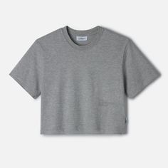 Streamline your wardrobe with The LOWGO Crop Tee, a shorter take on our signature LOWGO Tee. Made from soft, medium-weight 220gsm, 100% organic cotton, this t-shirt offers the same understated elegance with a modern, cropped silhouette. The subtle tone-on-tone logo, placed lower, discreetly nods to the brand’s commitment to refined minimalism, making it an effortless choice for those who appreciate subtle sophistication. Gray Cotton T-shirt For Loungewear, Heather Grey Cotton T-shirt For Loungewear, Heather Grey Cotton T-shirt For Summer, Casual Heather Grey T-shirt For Loungewear, Basic Boxy Fit Organic Cotton T-shirt, Everyday Organic Cotton Cropped T-shirt, Basic Relaxed Fit Cotton Jersey Tops, Organic Cotton Relaxed Fit Tops For Loungewear, Relaxed Fit Organic Cotton Tops For Loungewear