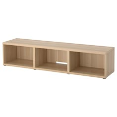 a wooden shelf with three open compartments