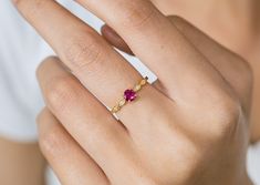 Features - Made to order - Materials: 14K Solid Gold - Gold Color: Yellow Gold, White Gold and Rose Gold - Gemstones: Ruby and natural Diamonds - Ruby Size: 4.5 mm (0.36 carat) - Diamond Size: 4 Pcs 1.0mm (0.02 carats) - Ring Width: 1.3mm  (Approximately) - Ring Height: 1.3mm (Approximately) - SKU: ERW7QF All Gold pieces are stamped with the metal type on the inside.  CONTACT US If you have any questions, please send us a message! CHECK OUT OUR OTHER SHOP We have another shop selling wedding bands and fine fashion jewelry with over 54,800+ sales and 12,500+ 5 star reviews. You can visit our other shop @ https://www.etsy.com/shop/qcustomjewelry Q Fine Jewelry offers a lifetime guarantee on all of our items. If you ever experience any issues with your purchase, please send us a message and w Amethyst Wedding Band, Vintage Opal Engagement Ring, Gold Knot Ring, Peach Sapphire Engagement Ring, Rose Gold Opal Ring, Unique Promise Rings, Ruby Anniversary, July Birthstone Ring, Raw Diamond Engagement Rings