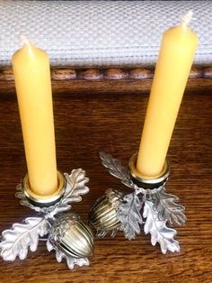 two candles sitting next to each other on a table