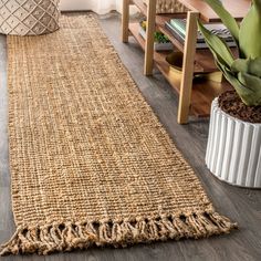 a living room with a rug on the floor