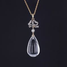 This necklace features a rock crystal drop with a bow of diamonds set in platinum with a 14k yellow gold bail. The diamond bow was originally an antique stickpin (circa 1890) and the rock crystal drop likely dates to the 1920s.  The pendant measures 2 inches from the top of the bail to bottom by 0.6 inches wide, and it is in great condition. We are providing the option to purchase the pendant with or without the 18 inch, 14k gold chain depicted in the photos. We have many other fantastic offerin Antique Drop Jewelry For Formal Occasions, Vintage Drop Jewelry For Formal Occasions, Formal Rose Cut Diamond Drop Jewelry, Antique Drop Necklaces For Formal Occasions, Formal Drop Rose Cut Diamond Jewelry, Elegant Clear Necklace For Formal Occasions, Formal Rose Cut Diamond Drop Necklaces, Formal Clear Jewelry With Rose Cut Diamonds, Vintage Diamond Cut Pendant Jewelry