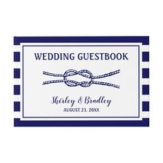 a wedding guest book with blue and white stripes on the cover, tied up to a knot