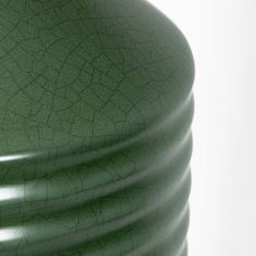 a close up view of a green vase