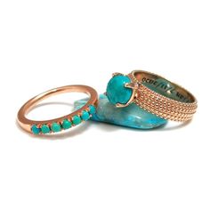 Express your eternal love with this exquisite Turquoise wedding rings set. Fashioned in 14K rose gold, the engagement ring showcases a rich light blue Turquoise gem as the center stone while dotted detailing adorns the ring's shank. To complete the ensemble, the solitaire ring accompanied by a dainty Turquoise lined wedding band.#jonjonjewel #BohoTurquoiseRings #TurquoiseRingSet #RoseGoldTurquoiseRing #WeddingRingSet #TurquoiseJewelry #EngagementRingSet #DecemberRings Turquoise Wedding Ring Set, Gold Turquoise Ring, Turquoise Wedding Rings, Boho Wedding Ring, Turquoise Ring Engagement, Rings Turquoise, Turquoise Gem, Boho Turquoise, Turquoise Gold Ring