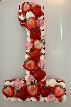 the letter j made up of strawberries and marshmallows