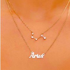 the name aris necklace is shown on top of a woman's chest