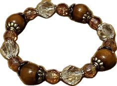 Brown Wooden Beads Bracelet, Brown Faceted Bead Bracelet, Brown Beaded Bracelets With Wooden Beads, Brown Bracelet With Spacer Beads As Gift, Brown Wooden Beaded Round Bracelets, Brown Bracelet With Spacer Beads For Gift, Brown Bracelets With Spacer Beads As Gift, Brown Bracelets With Spacer Beads For Gifts, Spiritual Brown Beaded Bracelets With Faceted Beads