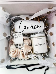 an open box containing candles and other items for the candlelight ceremony, with polka dot wrapping around it