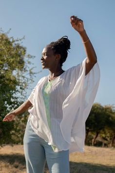 Your search for the perfect flowy top that billows effortlessly in the wind ends here. The Fifi top is the ultimate resort wear for when you're frolicking on the beach or dancing through a sea of people. Featuring tonal stripes and a geometric pattern inspired by Habesha Kemis, the traditional dress of Ethiopian women. Style Details: 100% Cotton Handwash Made in Ethiopia Menby Design Fit Details: One size fits all Ethiopian Women, Habesha Kemis, Fit Details, Flowy Top, Traditional Dress, Flowy Tops, American Express, Beach Wears, A Sea