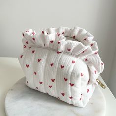 Handmade Frilly Makeup Bag - Red Heart Pattern Makeup Bag - Toiletry Travel Skincare Bag - Heart Makeup Bag 💄💕 This delightful red heart makeup bag is not just a makeup organizer; it's a piece of art! Handmade with love and care, this frilly creation is perfect for keeping your cosmetics in order. Crafted from high-quality quilted cotton, this bag blends durability with style seamlessly. Key Features: Adorable Red Heart Pattern: Fall in love with the charming red heart pattern that adds a sweet touch to your daily routine. ❤️ Handmade with Frills: Each frill is carefully crafted by hand, making this makeup bag a unique and eye-catching accessory. 🎀 High-Quality Quilted Cotton: %100 cotton muslin fabric, both inside and outside, with a fiber fabric layer in between, creates a fuller and Heart-shaped Shoulder Bag With Heart Print, Cute Heart Print Bag For Valentine's Day, Heart Print Bag For Valentine's Day Gift, Valentine's Day Heart Print Bag Gift, Valentine's Day Pouch Bag, Cute Heart-shaped Bags For Gifts, Heart-shaped Bag With Heart Detail For Everyday, White Rectangular Bag With Heart Print, Cute Everyday Heart-shaped Shoulder Bag