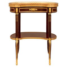 an ornate console table with gold trimmings on the top and bottom, against a white background