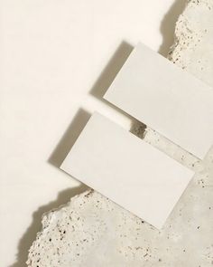 two pieces of paper sitting on top of each other