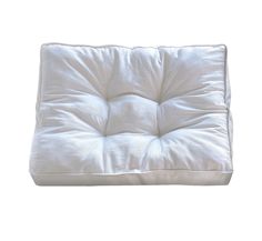 a white square cushion on a white background