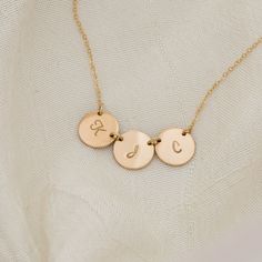 "Monogram Necklace, GOLD Initial Disc Charm Necklace, Birthday, Bridesmaid Gifts, Mother's Jewelry, Child, Family, Personalized Jewelry Very simple yet timeless necklace for everyday, bridal's party or birthday gift. This necklace can also look good with another necklace for a layered style or by itself. Circle Disc Necklace - size Medium * Thick Medium size disc .... approx. 7/16\" OD (11mm) * Each pendant will be smooth around the edges and put on your texture into a complete beautiful product Gold Initials Jewelry For Mother's Day, Gold Jewelry With Initials For Mother's Day, Personalized Gold Charm Necklace For Birthday, Gold Initials Name Necklace For Birthday, Gold Engraved Initial Necklace For Mother's Day, Gold Initials Name Necklace For Anniversary, Personalized Yellow Gold Charm Necklaces For Wedding, Gold Name Necklace With Hallmark For Anniversary, Gold Initial Pendant Jewelry With Hallmark