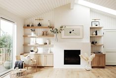 a living room filled with furniture and a fire place in the middle of a room