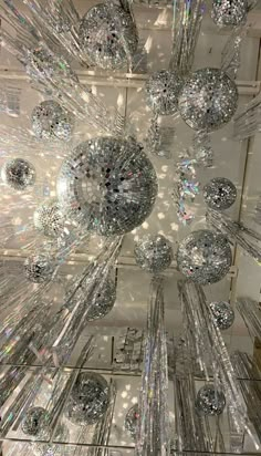 the ceiling is made up of many crystal balls and mirrors, all in different sizes