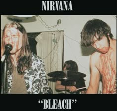 two young men with blood on their body playing drums in front of a microphone and the words nirvana bleach