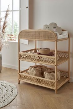 a wooden shelf with baskets on top of it