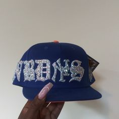 Custom Mix Size Full Bling Out Crystal Famous Nobody's Old English Embroidery Snapback Hat. Super Detail. 2 Other Colors Also Available, Hats Are Made To Order (This One Is Ready To Ship), Please Allow 2 Weeks To Ship For Custom Orders. Personal Hat, I Wasn't Looking To Sell But Only Willing To Sale For Asking Price. Price Includes The Cost Of This Limited Edition Twenty Two X Famous Nobody Hat (X Marks The Spot). Video Taken Without Flash. These Pics Doesn't Do This Hat Any Justice. Cool Fitted Hats, Fitted Hats Women, Custom Snapbacks, Bedazzled Hat, Customized Hats, Y2k Hats, Rhinestone Hat, Embroidery Hats, English Embroidery