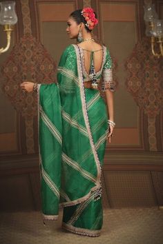 Emerald green silk organza�saree with�leheriya pattern gota work, dori, badla and purple border embroidery.�Comes with matching embroidered and padded blouse. - Aza Fashions Green Organza Pre-draped Saree With Dupatta, Green Tissue Silk Blouse With Dupatta, Green Art Silk Sharara With Unstitched Blouse, Green Organza Sharara With Cutdana Details, Designer Pista Green Silk Pre-draped Saree, Traditional Green Organza Blouse Piece, Green Organza Traditional Wear With Traditional Drape, Traditional Green Organza Wear With Traditional Drape, Green Organza Pre-draped Saree Traditional