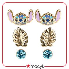 two pairs of earrings with ears and leaves on the front, one has blue crystals