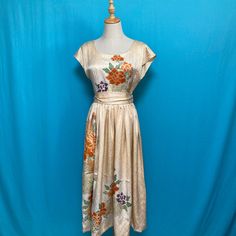 Measurements Size: about a US size 8 Bust: 35" (90 cm) Waist: 29" (75 cm) Skirt length: 31" (79 cm) Dress length: 47" (119 cm) This is a 1960-70's vintage silk kimono dress. This item is used vintage kimono , so please do not purchase if you are sensitive about it. The dress is not having a lining.  Click for larger image. *An item is considered wearable but has some surface flaws staining or soiling, for example. *As the dress has a flaw, you shall have it inexpensive! The dry cleaning of the cloth was carried out before making a dress. Check measurements provided for each garment and compare with a similar item you usually wear to ensure proper fit. ・・・・・・・・・・・・・・・・・・・・・・・・ Once in a while we may miss small flaws such as minor loose seams, tiny holes or very small or faint stains. Small Summer Silk Dress With Short Sleeves, Spring Evening Silk Embroidered Dress, Traditional Spring Dress With Kimono Sleeves, Fitted Silk Embroidered Summer Dress, Traditional Dresses With Kimono Sleeves For Spring, Traditional Silk Dress With Floral Print, Summer Wedding Silk Embroidered Dress, Silk Midi Dress With Kimono Sleeves, Spring Daywear Dresses With Kimono Sleeves