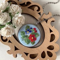 Embroidered viola necklace is a wonderful gift for women. Jewelry pendant with red and a blue viola flower perfect gift for mother, daughter or wife. Floral jewelry perfect for every day and for a special occasion.  This pendant is made in the technique of micro-embroidery cross stitch on cotton canvas with cotton threads.  The size of each stitch is less than 1 mm. MATERIALS: The color of the base and chain-silver (not silver plated), material-stainless steel, lobster claw clasp.  Canvas Zweiga Handmade Flower Necklace As Gift For Mom, Handmade Flower Necklace Gift, Handmade Necklaces For Mother's Day Crafting, Handmade Purple Flower Necklace For Gift, Handmade Blue Necklaces As Gift For Mom, Blue Flower Necklace Gift, Handmade Flower Pendant Necklace For Mother's Day, Handmade Flower Pendant Necklace For Mom, Handmade Flower Pendant Necklace As Gift For Mom